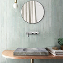Tundra Grey Marble Rectangular Bathroom Vanity carved from Solid Block (W)18" (L)40" installed above vanity green wall tiles and chrome wall mount faucet round mirror