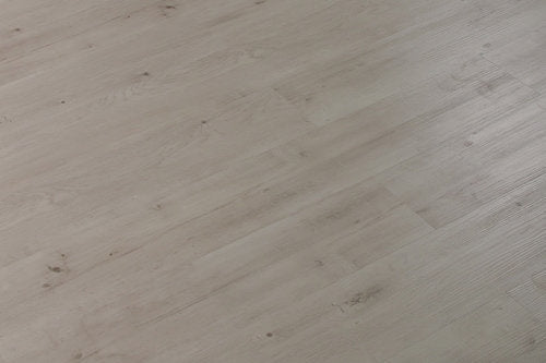 Close-up of a light wood flooring surface with natural grain patterns.