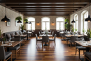 Modern restaurant interior with wooden floors, tables, chairs, and large windows.