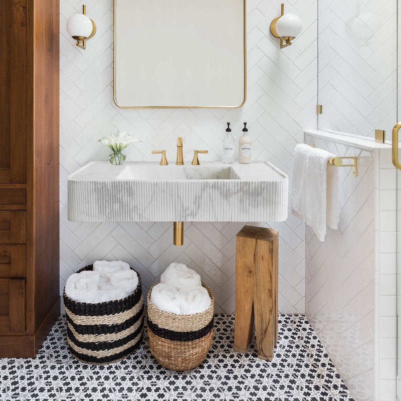 Carrara White Marble Wall-mount Bathroom Vanity Ribbed Textured Front (W)16" (L)38" (H)6"  installed modern bathroom white herringbone tiles on wall gold faucet and drain pipes