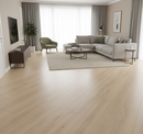 Modern living room with light wood flooring, gray sectional sofa, and decorative elements.