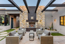 DaVinci 3D Onyx Travertine Ledger 3D Panel 6"x24" Honed and Split-face mixed Natural Wall Tile installed around fireplace outdoor furniture set with 3 coffee tables wide view