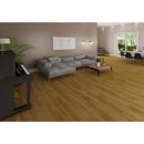 Hickory rigid core luxury vinyl plank flooring 7x48 SPC14060748-22M installed on a living room piano and L shaped couch in the room