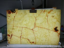 Marble slab with green and brown veins on a stand