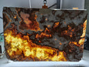 Onyx stone with a unique pattern of colors on a white surface