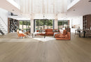 Modern living room with orange sofa, coffee table, and large windows. K-05VH