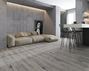 SPC Vinyl Rigid Core 7" Width 60" RL, 6mm Thick, 1.5mm IXPE Keystone Grey, Invicta Floors - Mazzia Collection sitting couch view 2