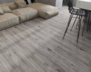 SPC Vinyl Rigid Core 7" Width 60" RL, 6mm Thick, 1.5mm IXPE Keystone Grey, Invicta Floors - Mazzia Collection sitting couch view 3