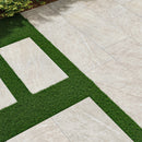 Patterned stone pavement with grass border