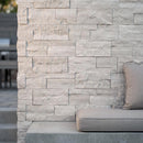 Close-up of a stone wall with a small opening