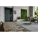 Modern outdoor patio with stone pathway, garden, and seating area.