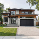 Modern two-story house with a driveway and green lawn