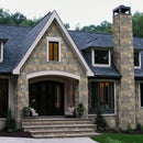 Stately house with stone facade and dark roof