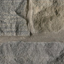 Close-up of stone masonry with a focus on texture and color variation.