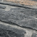 Close-up of gray stone slabs with a blurred background