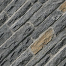 Close-up of a stone wall with gray and brown stones