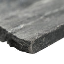 Close-up of a dark gray stone slab with a blurred background