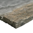 Close-up of a stone slab with water in the background