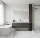 Modern bathroom with freestanding bathtub, vanity, and shower area.