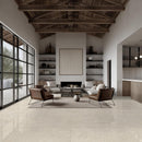 Modern living room with large windows, wooden ceiling beams, and neutral color palette.