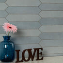 Renzo sky pickett 2.5x13 glossy ceramic blue wall tile NRENSKYPIC2.5X13 product shot multiple tiles living room wall view 1