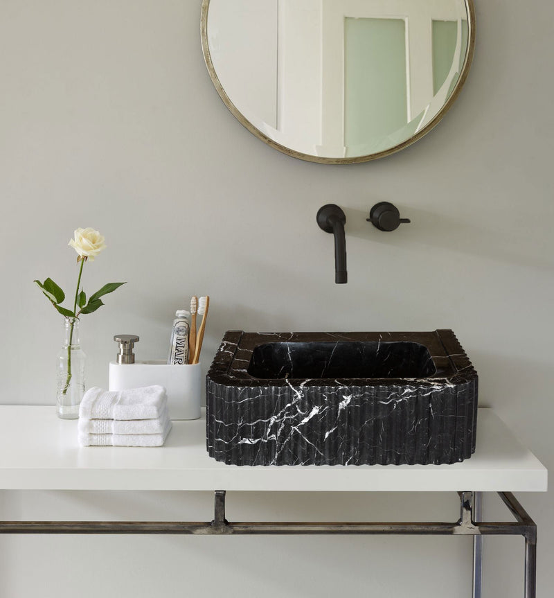 Toros Black Marble Rectangular Wall-mount Bathroom Sink Polished (W)12" (L)19" (H)7" installed above vanity yellow rod inside a bottle toothpaste and toothbrushes and wall mount black faucet