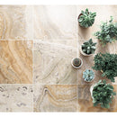 Traonyx travertine tiles honed 18x18 TONYX18x18H installed on floor with plants in pots