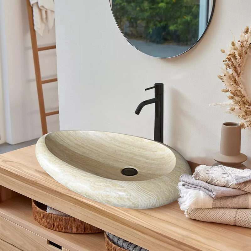 Troia Light Travertine Natural Stone Teardrop Shape Above Vanity Bathroom Vessel Sink (W)14" (L)20" (H)5" bathroom view installed above wooden vanity black faucet towels and sound mirror on wall