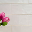 Urbano crema ceramic white subway tile 4x12 glossy  msi collection NURBCRE4X12 product shot table view 5