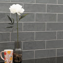 Urbano graphite ceramic gray subway tile 4x12 glossy NURBGRA4X12 product shot table view 2