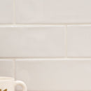 Urbano pure ceramic white subway tile 4x12 glossy  msi collection NURBPUR4X12 room shot table view 5
