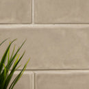Urbano warm concrete ceramic gray subway tile 4x12 glossy  NURBWARCON4X12 room shot table view 5
