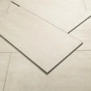 Close-up of beige tiles with a subtle pattern