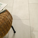 Wicker chair leg on a tiled floor
