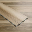 Close-up of a wooden flooring panel on a matching wooden floor.