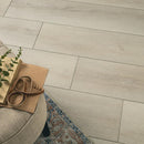 Wooden floor with a book and plant on a chair