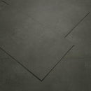 Dark gray tiles arranged in a herringbone pattern