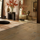 Waterproof engineered hardwood planks installed in a bright room with a clean, seamless look