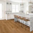 Modern kitchen with marble island and wooden floor