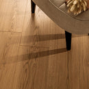 Wooden floor with a chair partially visible