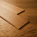 Close-up of wooden flooring with a focus on texture and pattern.