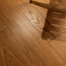 Close-up of a wooden floor with a warm brown color.