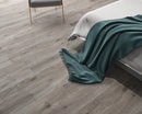 SPC Vinyl Rigid Core 7" Width 60" RL, 6mm Thick, 1.5mm IXPE Venetian Iron, Peninsula - Mazzia Collection bed view 