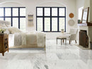 blue whisper exotic marble tile 16x32 polished installed on bright bedroom floor fireplace white armchair