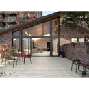 caldera grigia porcelain pavers 16x47in matte floor tile LPAVNCALGRI1647 installed on a terrace of a condo with 4 iron chairs and table