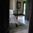 Denizli Beige Antique Pattern Travertine Tile - Full Truckload brushed and chiseled installed on bedroom floor with hand-made solid wood closet