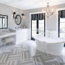 equator white marble floor wall tile 24x24 polished installed on modern contemporary bathroom with modern furniture and white bathtub in middle