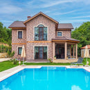 manufactured stone brick veneer barok cotto caramel lava mixed installed facade house walls swimming pool