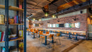 manufactured stone brick veneer granulbrick 50 red handmade B04RE 102285 installed on cafe walls bookshelf_b363ce63