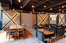 manufactured stone brick veneer granulbrick 50 red handmade B04RE 102285 installed on cafe walls wooden table chairs